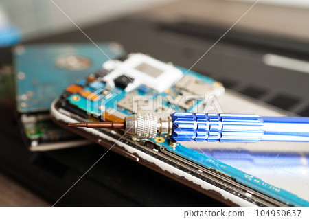 Repairing and upgrade mobile phone, electronic, computer hardware and technology concept. Repairing and upgrade mobile phone, electronic, computer hardware and technology concept. 104950637