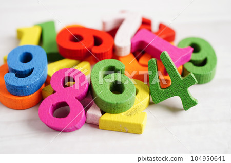 Number wood block cubes for learning Mathematic, education math concept. 104950641