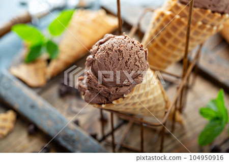 Chocolate mint ice cream in waffle cones Chocolate mint ice cream in waffle cones 104950916