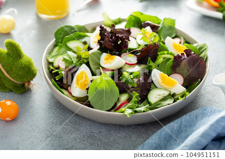 Fresh green salad with boiled eggs for Easter brunch 104951151