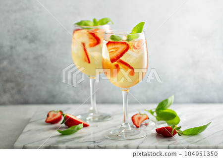 Summer white sangria with strawberries Summer white sangria with strawberries 104951350