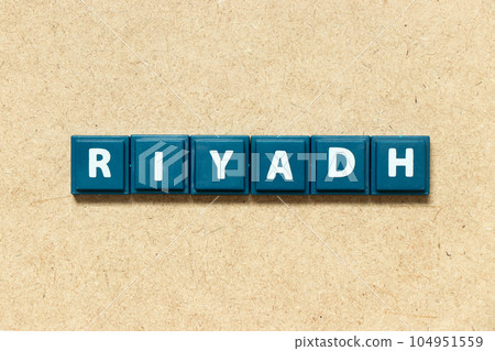 Tile alphabet letter in word riyadh on wood background Tile alphabet letter in word riyadh on wood background 104951559
