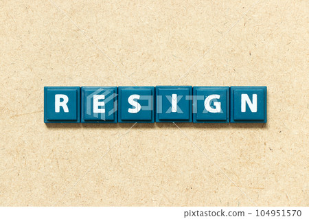Tile alphabet letter in word resign on wood background 104951570