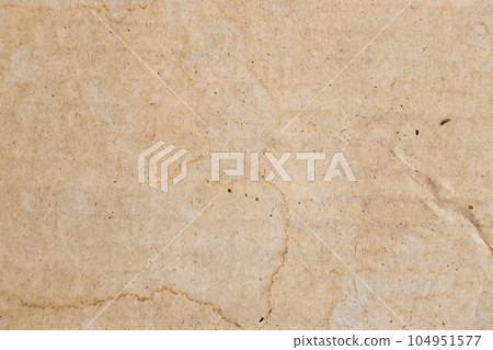 Water stained on brown corrugated packaging material background. Use as texture or layer decoaration 104951577