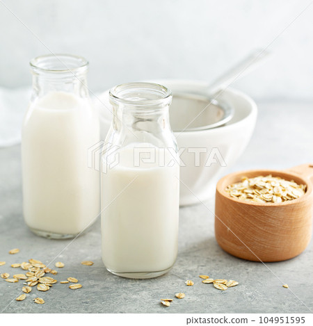 Oat milk in glass bottles Oat milk in glass bottles 104951595
