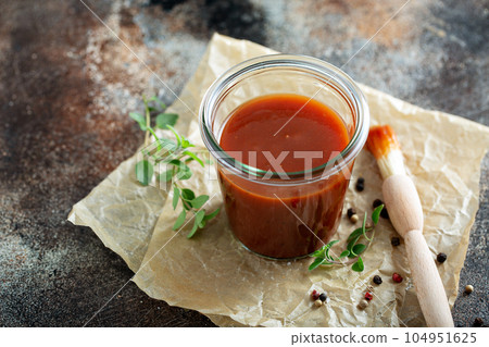 Homemade barbeque sauce in a jar 104951625