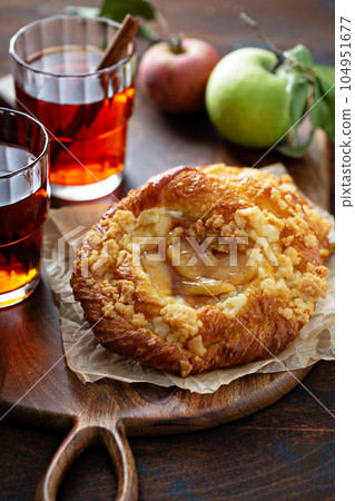 Apple danish pastry with cinnamon tea Apple danish pastry with cinnamon tea 104951677