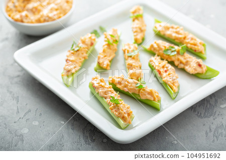 Celery sticks with pimento cheese Celery sticks with pimento cheese 104951692