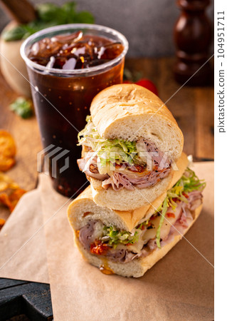 Ham sandwich with melted cheese and tomato pesto Ham sandwich with melted cheese and tomato pesto 104951711