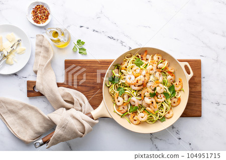 Shrimp and zucchini noodles pasta with parmesan Shrimp and zucchini noodles pasta with parmesan 104951715