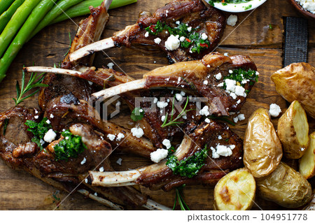 Grilled lamb chops with asparagus and potatoes Grilled lamb chops with asparagus and potatoes 104951778