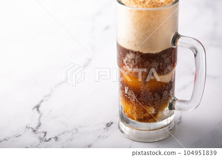 Root beer or soda ice cream float Root beer or soda ice cream float 104951839