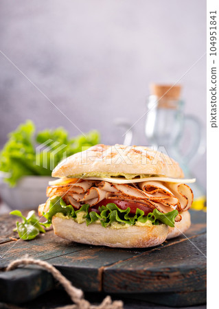 Fresh and healthy pesto turkey sandwich 104951841