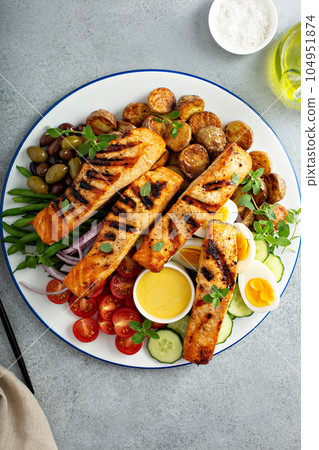Grilled salmon Nicoise salad 104951874