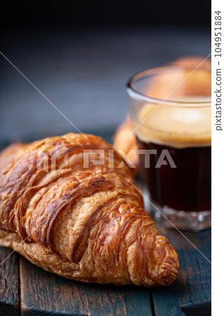 Croissant with coffee 104951884