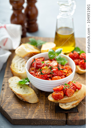 Bruschetta with roasted tomatoes 104951901