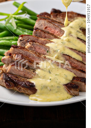Steak with bearnaise sauce with tarragon Steak with bearnaise sauce with tarragon 104951917