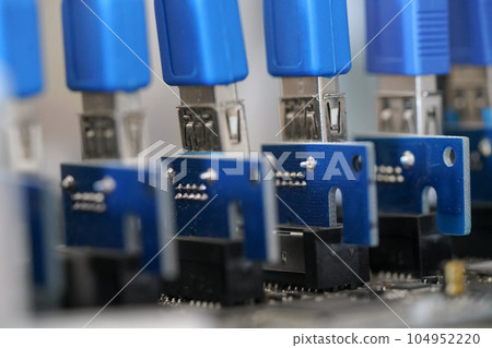 Detail photo of PCI graphics cards risers on cryptocurrency mining rig 104952220