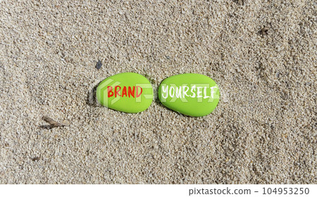 Brand yourself symbol. Concept words Brand yourself on beautiful green stone. Beautiful sand beach background. Business brand yourself concept. Copy space. Brand yourself symbol. Concept words Brand yourself on beautiful green stone. Beautiful sand beach background. Business brand yourself concept. Copy space. 104953250