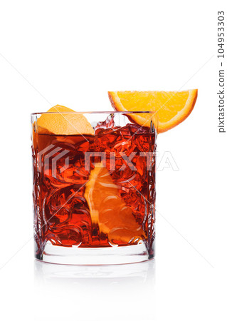 Negroni Cocktail in crystal glass with ice cubes and orange slices on white backgroun Negroni Cocktail in crystal glass with ice cubes and orange slices on white backgroun 104953303