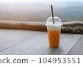 iced coffee on wood table 104953551