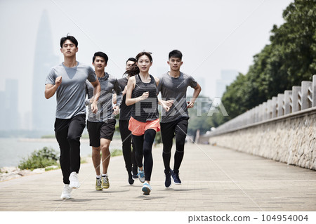 group of five young asian adult men and woman running training outdoors group of five young asian adult men and woman running training outdoors 104954004