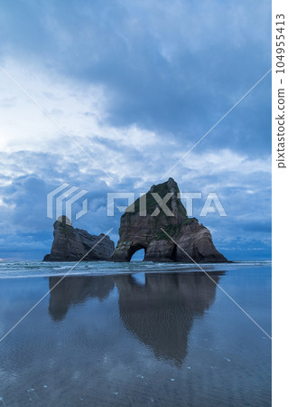 Archway Islands and Tasman Sea at Wharariki Beach, New Zealand Archway Islands and Tasman Sea at Wharariki Beach, New Zealand 104955413