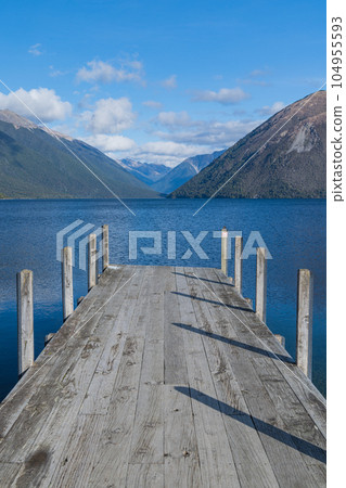 Lake Rotoiti and the Southern Alps seen from the pier in Nelson Lakes National Park, New Zealand Lake Rotoiti and the Southern Alps seen from the pier in Nelson Lakes National Park, New Zealand 104955593