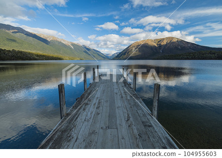 Lake Rotoiti and the Southern Alps seen from the pier in Nelson Lakes National Park, New Zealand 104955603