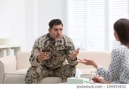 Psychotherapist working with male military officer in office 104955632