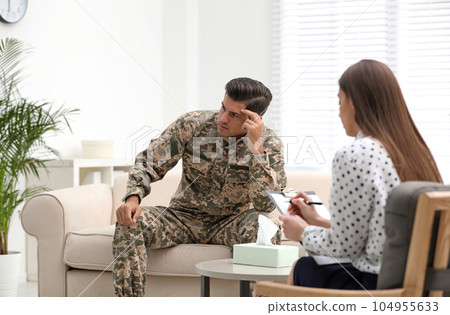 Psychotherapist working with male military officer in office 104955633