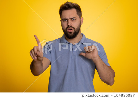 Confused displeased surprised caucasian man pointing fingers hisself, rejection, refusal, stop sign Confused displeased surprised caucasian man pointing fingers hisself, rejection, refusal, stop sign 104956087