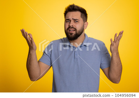 Man raising hands in indignant expression ask why what reason of failure demonstrating disbelief 104956094