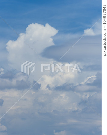 Summer sky with rising cumulonimbus clouds 104957042