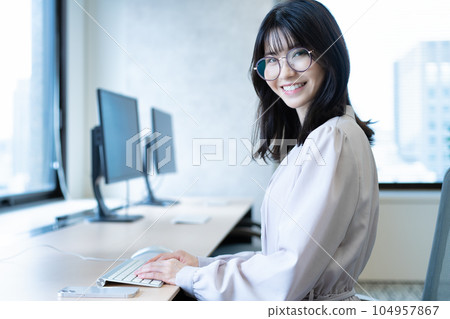 Middle woman working in the office Middle woman working in the office 104957867