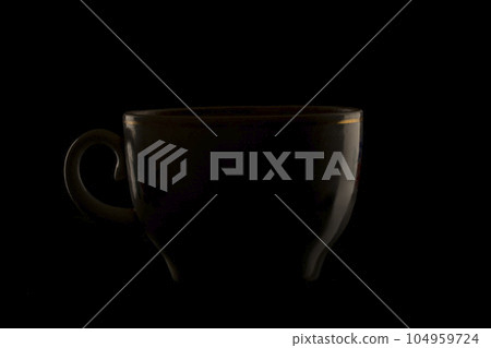 contour reflection of a cup on a black background 104959724