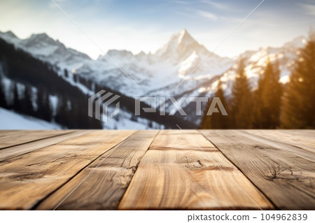 The empty wooden table top with blur background of Alpine with snow capped. Exuberant. The empty wooden table top with blur background of Alpine with snow capped. Exuberant. 104962839