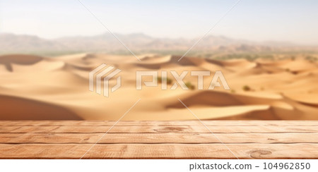 The empty wooden brown table top with blur background of desert dune mountain. Exuberant. 104962850