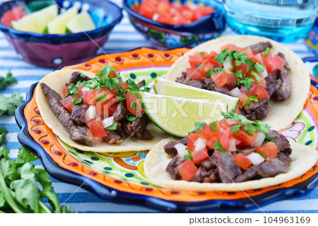 Delicious Mexican tacos Delicious Mexican tacos 104963169