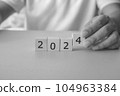 Business man planing for the year 2024. Black and White Image. 104963384