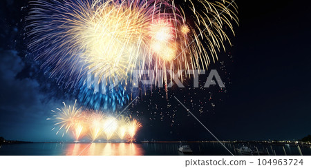 Incredibly beautiful fireworks over the water against the night sky. AI generated image Incredibly beautiful fireworks over the water against the night sky. AI generated image 104963724