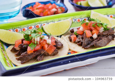 Delicious Mexican tacos Delicious Mexican tacos 104963739