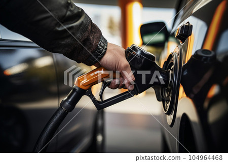 Male hand refueling gasoline: AI generated image Male hand refueling gasoline: AI generated image 104964468