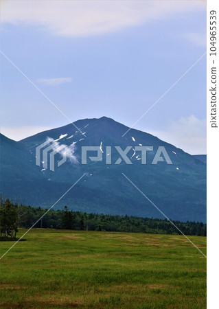 Hokkaido in July, embraced by the bosom of Daisetsuzan National Park, Hokkaido in early summer with a view of Mt. Tokachi, Mt. Furano, Mt. Biei, and Mt. Biei Hokkaido in July, embraced by the bosom of Daisetsuzan National Park, Hokkaido in early summer with a view of Mt. Tokachi, Mt. Furano, Mt. Biei, and Mt. Biei 104965539