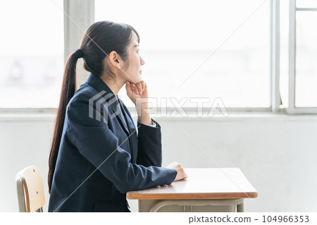 High school girls and junior high school students are worried in a school classroom (worry, trouble, stress) High school girls and junior high school students are worried in a school classroom (worry, trouble, stress) 104966353