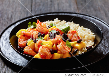 shrimps with beans, mango, brown rice in bowl shrimps with beans, mango, brown rice in bowl 104967330