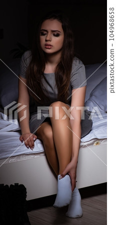 Tired businesswoman working overtime at home at night Tired businesswoman working overtime at home at night 104968658