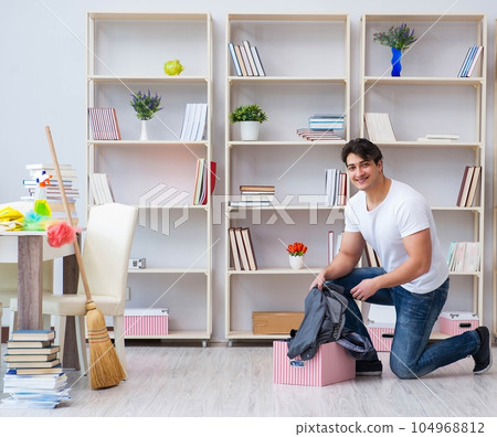 Man doing cleaning at home 104968812