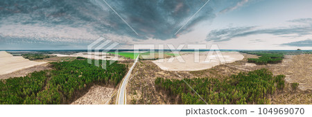 Aerial View Of Highway Road Through Deforestation Area Landscape. Green Pine Forest In Deforestation Zone. Top View Of Field And Forest Landscape. Drone View. Bird's Eye View. 104969070