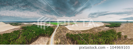 Aerial View Of Highway Road Through Deforestation Area Landscape. Green Pine Forest In Deforestation Zone. Top View Of Field And Forest Landscape. Drone View. Bird's Eye View. 104969103